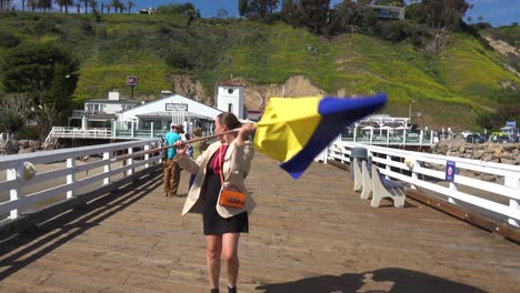 Aerial-Ukrainian-Antiwar-Protesters-Display-A-Long-Flag-And-Signs-On-Pacific-Coast-Highway-Pch-Malibu-California-To-Protest-The-Russian-Invasion-Of-Ukraine