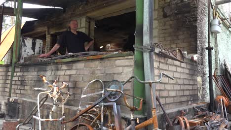 A-Man-Stands-In-The-Burned-Out-And-Destroyed-Remains-Of-His-Home-After-Russian-Shelling-In-Irpin,-Ukraine