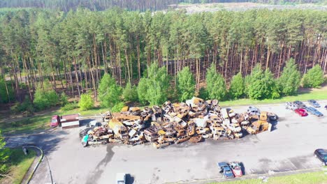 Aerial-Of-Wrecked-And-Burned-Cars-In-The-Car-Cemetery-Sitting-In-A-Pile-Many-With-Bullet-Holes-From-Russian-Aggression,-Irpin-Ukraine