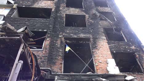 Remarkable-Shot-Of-Ukrainian-Flag-In-Burned-Window-Sill-Of-Destroyed-Apartment-Complex-In-Irpin-Kyiv-Ukraine