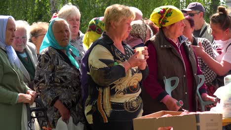 Ukrainian-Refugees-Wait-In-Line-For-Food-In-Borodyanka,-Ukraine-Following-Russian-Airstrikes-Which-Destroyed-Most-Of-Their-City