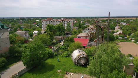 Aerial-Of-Makariv,-Ukraine-Bombed-And-Rocketed-Apartment-Buildings-And-Destroyed-Water-Tank-During-Russian-Invasion-And-Occupation