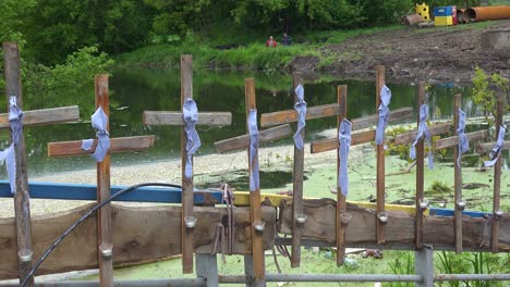 Crosses-Of-Victims-Line-The-Length-Of-The-Destroyed-Bridge-At-Irpin,-Credited-With-Saving-Kyiv-From-Russian-Invasion