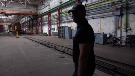 Ukrainian-Celebrity-Chef-Nikolay-Tischenko-Walks-Through-A-Railway-Maintenance-Facility-Is-Destroyed-By-Russian-Rockets-In-Kyiv,-Ukraine