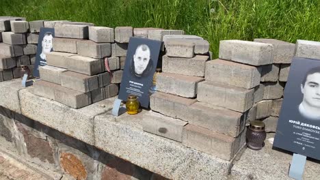 A-Roadside-War-Memorial-For-Soldiers-With-Faces,-Flowers-And-Candles-Lines-A-Street-Near-The-Maidan-Independence-Square-In-Central-Kyiv,-Kiev,-Ukraine