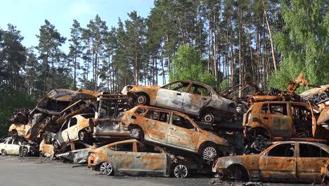 Stacked-Cars-Are-Riddled-With-Bullet-Holes-Along-A-Street-In-Irpin-Ukraine-During-The-Russian-Occupation