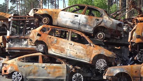 Stacked-Cars-Are-Riddled-With-Bullet-Holes-Along-A-Street-In-Irpin-Ukraine-During-The-Russian-Occupation