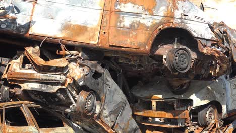 Stacked-And-Destroyed-Cars-Are-Riddled-With-Bullet-Holes-Along-A-Street-In-Irpin-Ukraine-During-The-Russian-Occupation