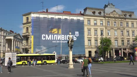 A-Huge-Patriotic-Banner-On-A-Building-In-Downtown-Lviv,-Ukraine-Says-""Courage-Has-Two-Colors""