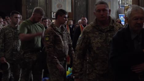 Mourners-Pass-By-And-Lay-Offerings-At-The-Coffin-Of-A-Dead-Ukrainian-Soldier-During-A-Funeral-Service-In-Lviv,-Ukraine