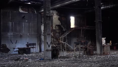 Pan-Across-The-Burned-Out-Interior-Of-A-Ukrainian-Wood-Mill-Factory-With-Russian-V-Symbols-Drawn-As-Graffiti