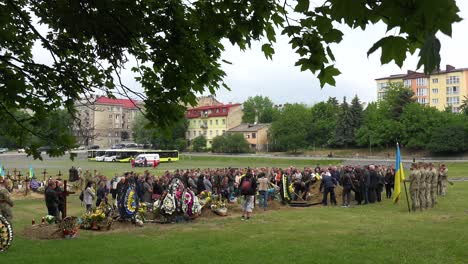 A-Large-Family-Gathering-For-The-Burial-At-The-Gravesite-Of-A-Fallen-Ukrainian-Soldier-In-Lviv,-During-The-War-In-Ukraine