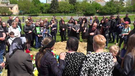 A-Large-Family-Gathering-For-The-Burial-At-The-Gravesite-Of-A-Fallen-Ukrainian-Soldier-In-Lviv,-During-The-War-In-Ukraine