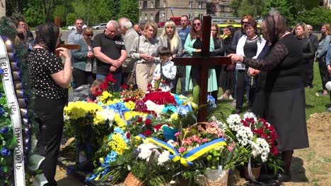 A-Large-Family-Gathering-For-The-Burial-At-The-Gravesite-Of-A-Fallen-Ukrainian-Soldier-In-Lviv,-During-The-War-In-Ukraine