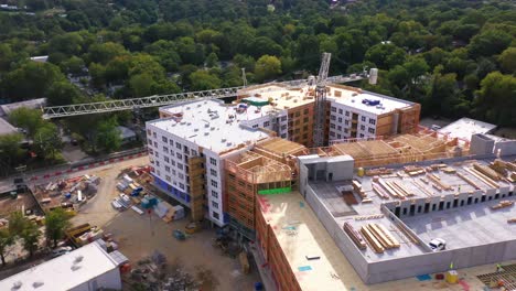 Good-Aerial-Over-A-Large-Construction-Site-With-Crane-And-Workers