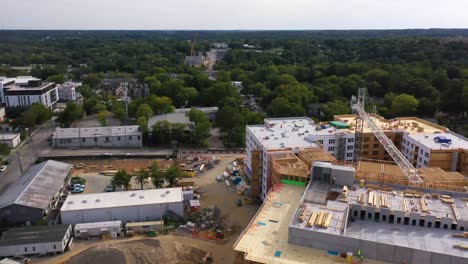 Good-Aerial-Over-A-Large-Construction-Site-With-Crane-Moving-And-Workers