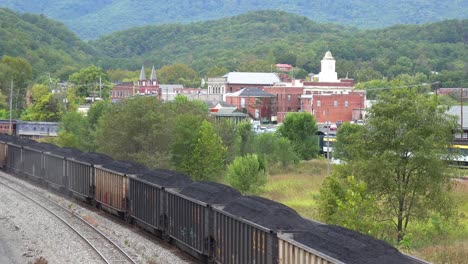 A-Long-Coal-Train-Rumbles-Through-Virginia-And-West-Virginia-Suggesting-American-Coal-Towns