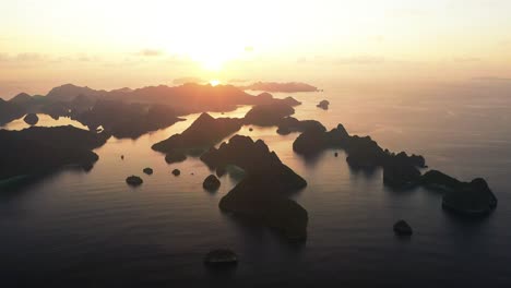 Excellent-Aerial-Shot-Of-Sunset-At-Wayag-Island,-Raja-Ampat,-Indonesia