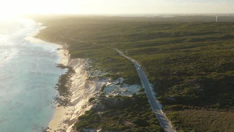 Excellent-Aerial-Shot-Of-An-Rv-Driving-On-Great-Ocean-Drive-Alongside-The-Beach-In-Esperance,-Australia