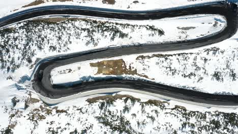 Excellent-Bird'S-Eye-View-Of-A-Car-Driving-Along-The-S-Curve-From-Wintry-Davos-To-St-Moritz,-Switzerland