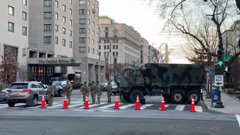 National-Guard-Troops-Patrol-The-Capitol-Washington-Dc-Following-The-Trump-Insurrection-And-Riots,-Military-Trucks-Block-The-Streets