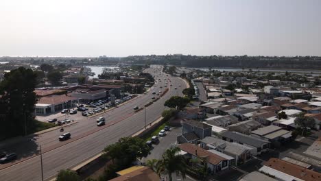 Excellent-Aerial-View-Of-Cars-Driving-Down-Highway-One-By-Newport-Beach,-California