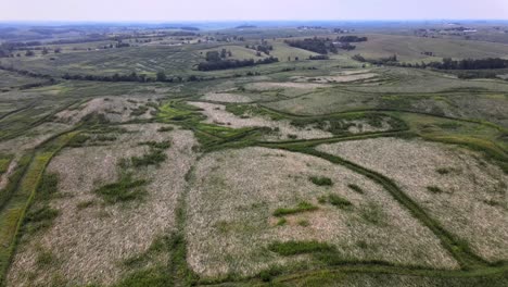 Aerial-Drone-Video-Wind-Damage-To-Rural,-Agrarian-Agricultural-Crops-And-Farmland-In-The-Midwest-Heartland-Of-Iowa