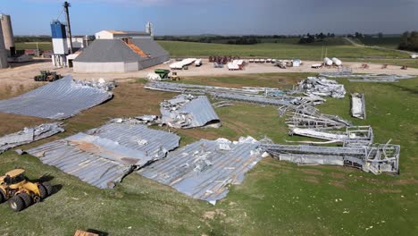 Aerial-Drone-Footage-Storm-Damaged-Grain-Elevators-Destroyed-By-High-Winds-And-Bad-Weather,-Midwest-Farm-Country,-Iowa