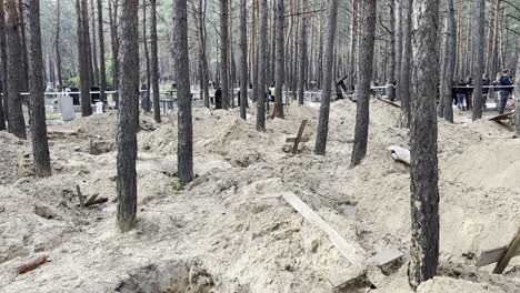 Mass-Graves-Suggest-Russian-War-Crimes-In-A-Forest-In-Izium,-Ukraine-Following-The-Regions-Liberation