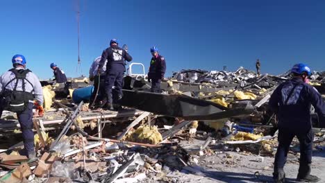 Emergency-Rescue-Workers-Search-Rubble-Of-Mayfield-Consumer-Products-Candle-Factory-After-It-Was-Destroyed-During-A-Massive-Tornado-In-Kentucky