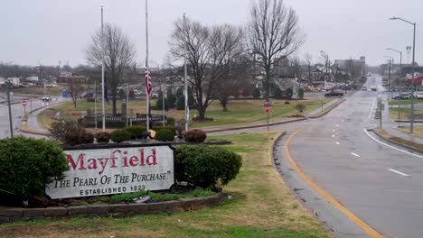 Establishing-Shot-Of-The-Destroyed-Downtown-Of-Mayfield,-Kentucky,-With-Sign-Saying-""Pearl-Of-The-Purchase""