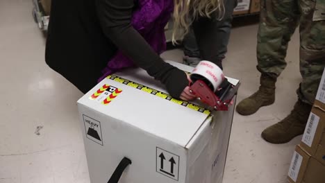 Oklahoma-National-Guard-Members-Pack-Boxes-And-Help-Distribute-Covid-19-Vaccine-Doses-Around-The-State