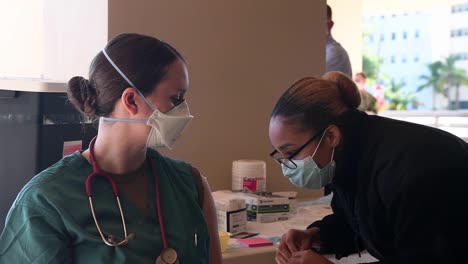 Personnel-Assigned-To-The-Naval-Medical-Center-San-Diego-Distribute-Their-First-Covid-19-Vaccine-Doses