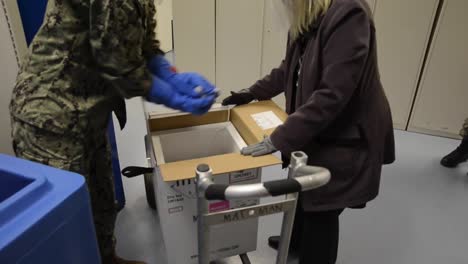 Personnel-Assigned-To-The-Naval-Medical-Center-San-Diego-Distribute-Their-First-Covid-19-Vaccine-Doses