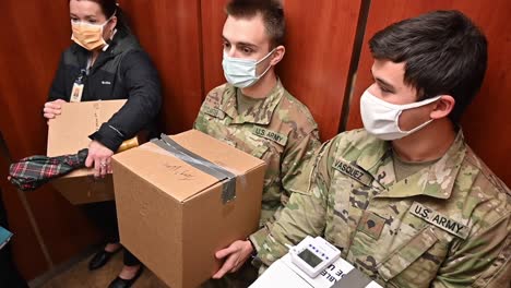 West-Virginia-National-Guard-Soldiers-Fulfill-A-Pfizer-Covid-19-Pandemic-Vaccine-Order-From-A-Healthcare-Provider