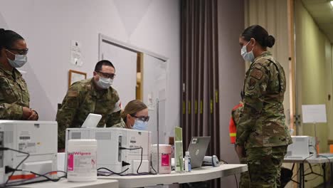 The-Enoculation-Process-For-The-First-Recipient-Of-The-Covid-19-Pandemic-Vaccine-At-Nellis-Air-Force-Base,-Nevada