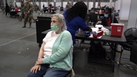 Arlene-Radmin,-The-First-Priority-1B-Resident-Of-New-York-To-Be-Vaccinated-At-The-Javits-Center-In-New-York-City,-Ny