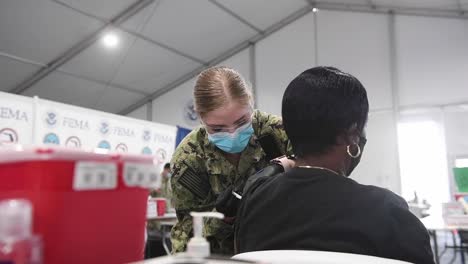 Us-Navy-Sailors-Prepare-And-Deliver-Covid-19-Shots,-Vaccines-Jacksonville-Community-Vaccination-Center,-Fl