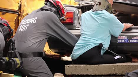 Soldiers-Conduct-Vehicle-Extraction-Techniques-At-The-Muscatatuck-Urban-Training-Center,-Indiana