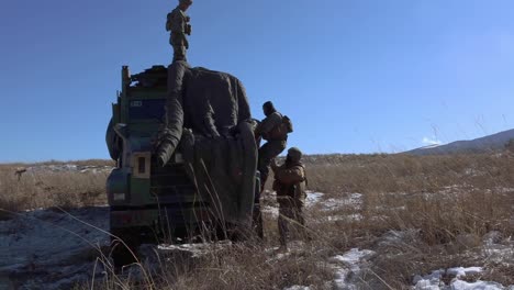 3Rd-Marine-Division-Soldiers-Set-Up-A-Camouflage-Tent-During-A-Field-Artillery-Training-Exercise-At-Camp-Fuji,-Japan