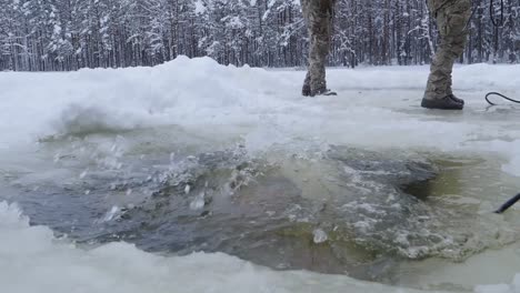 Slow-Motion,-Nato-Enhanced-Presence-Battlegroup-Estonia-Soldiers-Ice-Water-Plunge-During-Winter-Training