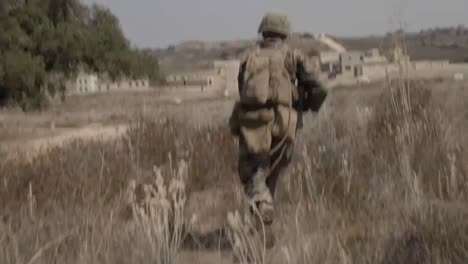 Us-Marine-Soldiers-Learn-To-Move-While-Attacking-A-Concrete-Block-Compound-During-A-Mechanized-Boat-Raid-And-Beach-Extraction-Training-Exercise,-Ca