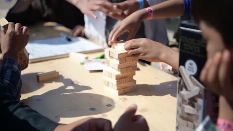 Us-Air-Force-Airmen-Play-Jinga-With-Afgani-Children,-Awaiting-Processing-After-Evacuation-From-Kabul-By-Biden-Administration,-Ramstein-Afb,-Germany