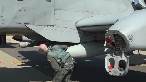 A-10-Thunderbolt-Ii-Jet-Fighter-Plane-Maintenance-And-Pre-Flight-Checks-By-Pilots-And-Ground-Crew,-Volk-Field,-Wisconsin