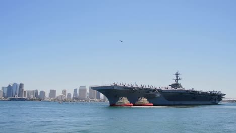 Tugboats-Guide-The-Departure-Of-The-Uss-Carl-Vinson-Deploying-For-Global-Maritime-Security-Operations-From-San-Diego