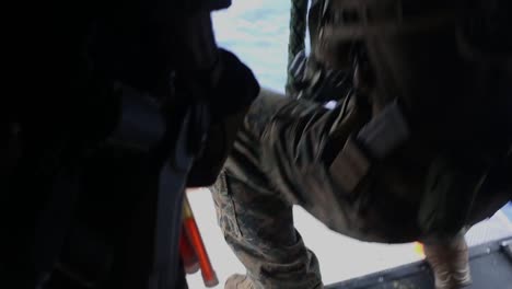 Us-Marines-Conduct-A-Fast-Rope,-Live-Fire-Deck-Shoot-On-The-Uss-America-With-M4-Carbines