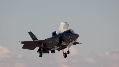 Italian-Jet-Fighter-Lands-During-A-Cross-Dock-Operation,-Hms-Queen-Elizabeth-And-Its-Cavour,-Mediterranean-Sea