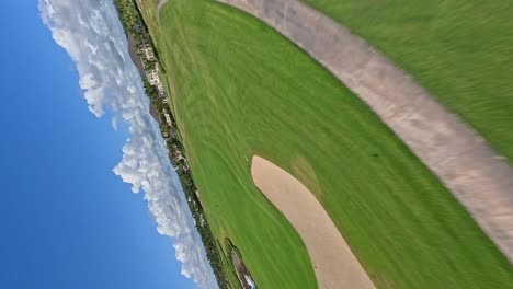 Vertical-Dynamic-speed-flight-over-luxury-Coreles-Golf-Club-with-sandy-court-and-luxury-hotel