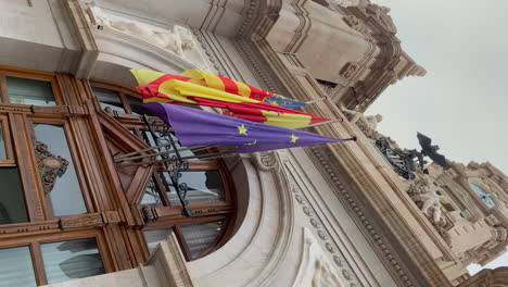 Flags-of-Spain,-the-Valencian-Community-and-the-European-Union-on-the-balcony-facade-of-the-Valencia-City-Hall