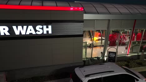 Car-on-conveyor-belt-inside-automatic-car-wash